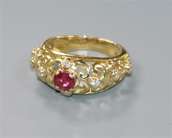 A French 18ct yellow metal, ruby and diamond pierced dress ring, size L.